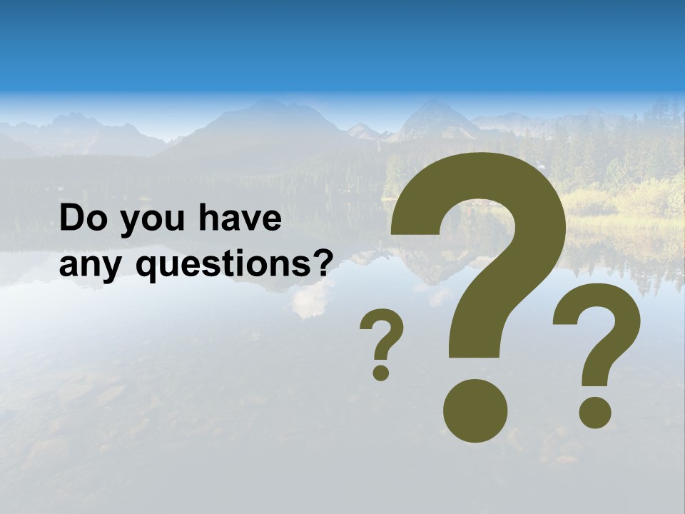 A Lake With Mountains In The Background And A Blue Sky PowerPoint Template