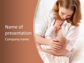A Woman Holding A Baby In Her Arms PowerPoint Template