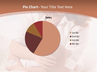 A Woman Holding A Baby In Her Arms PowerPoint Template