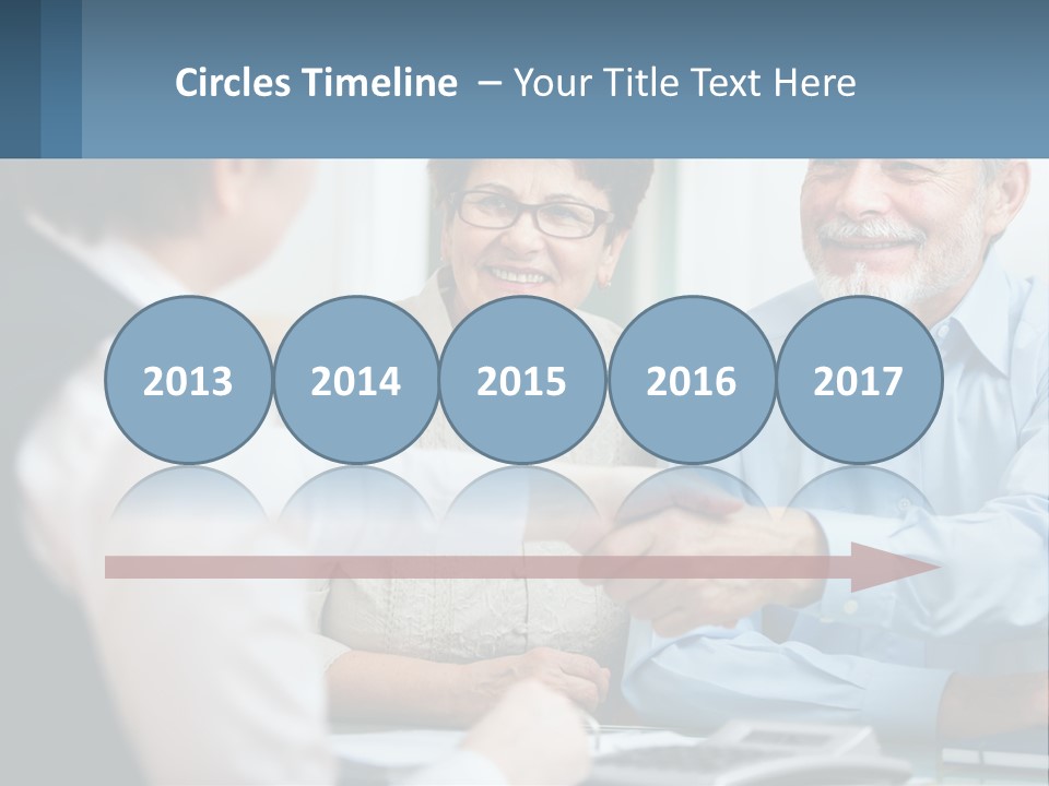 A Couple Of People Shaking Hands Over A Desk PowerPoint Template