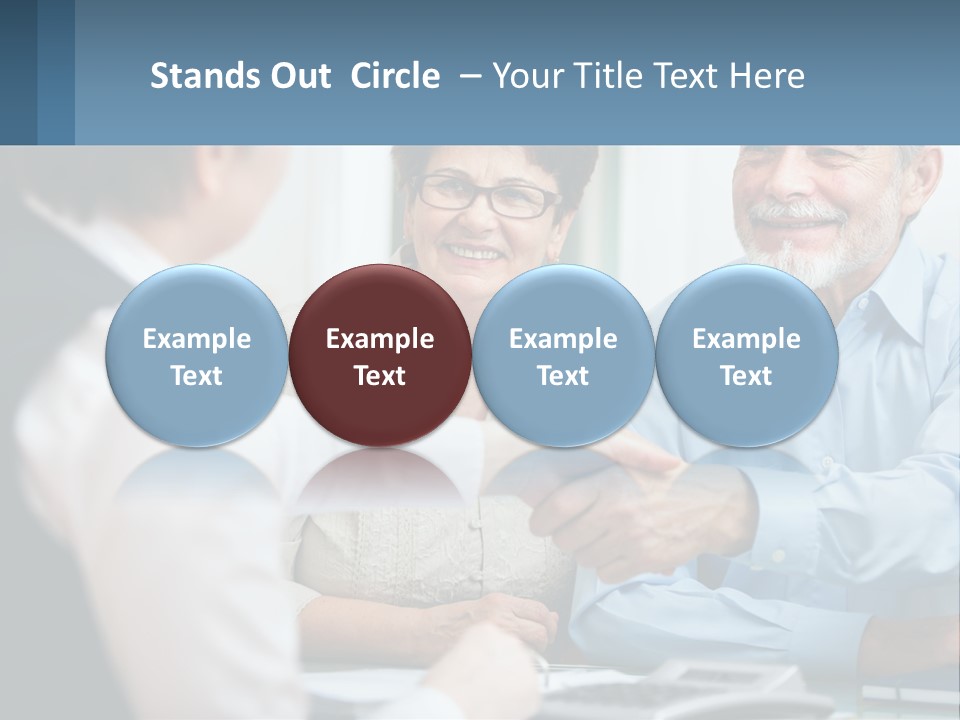 A Couple Of People Shaking Hands Over A Desk PowerPoint Template