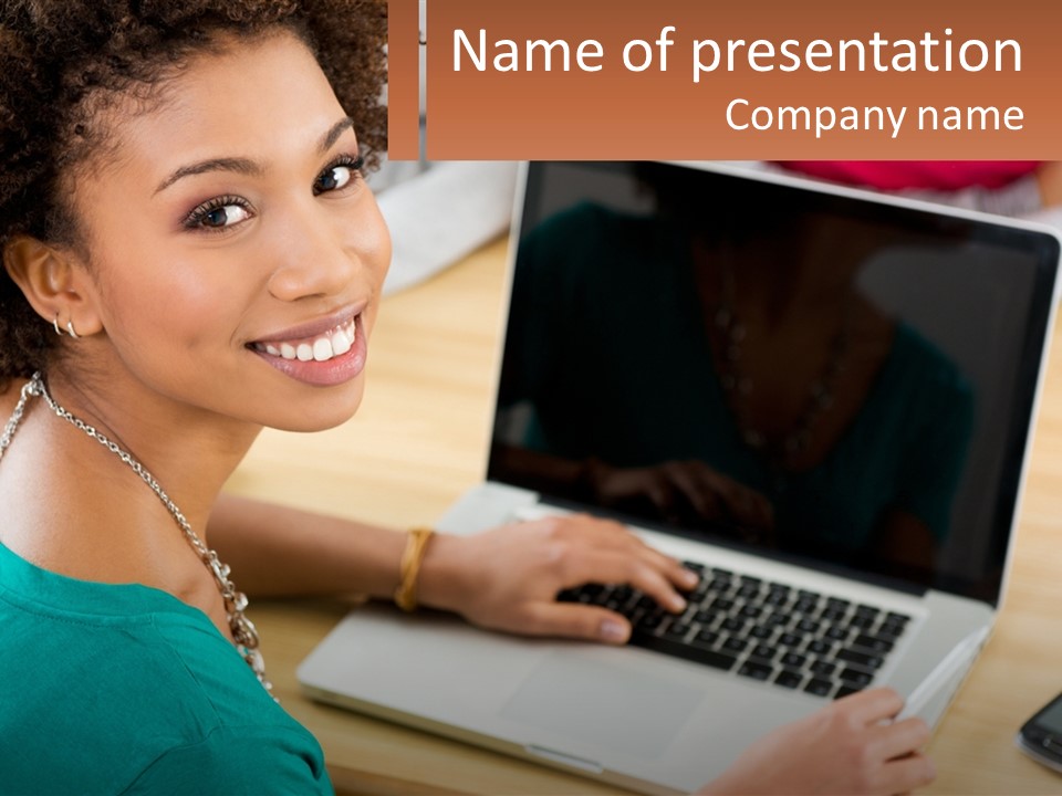 A Woman Sitting In Front Of A Laptop Computer PowerPoint Template