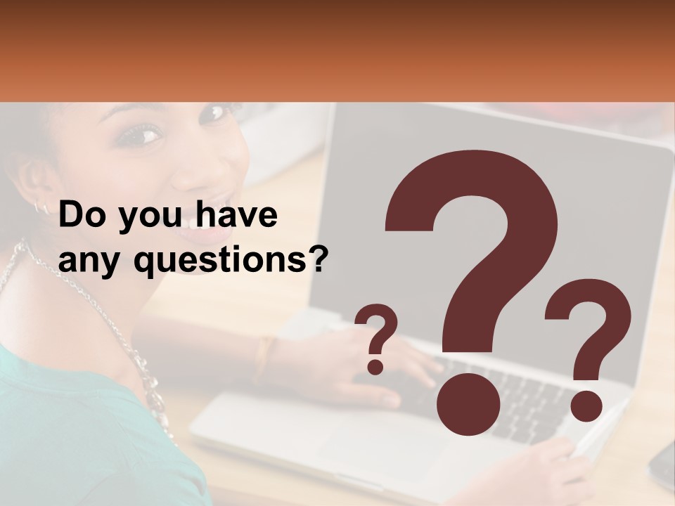 A Woman Sitting In Front Of A Laptop Computer PowerPoint Template
