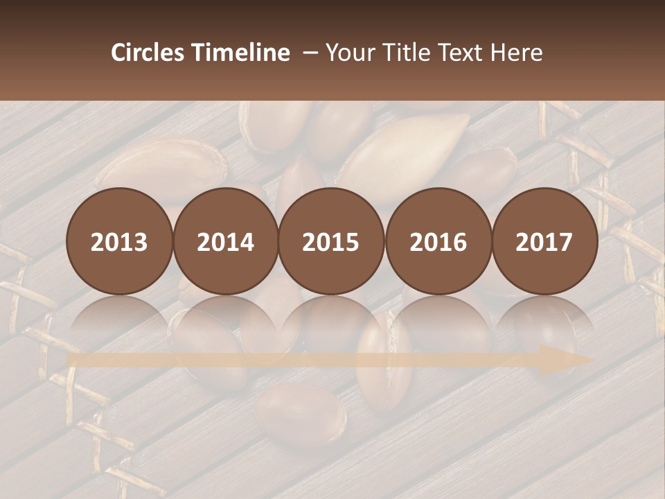 A Bunch Of Nuts On A Wooden Table PowerPoint Template