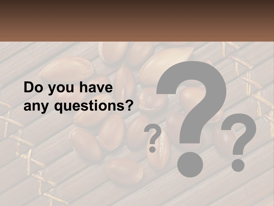 A Bunch Of Nuts On A Wooden Table PowerPoint Template