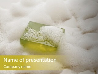 A Sponge With Foam On Top Of It In The Snow PowerPoint Template