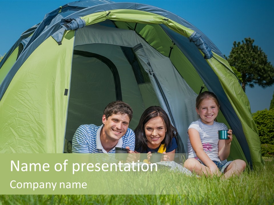 A Group Of People Sitting Inside Of A Green Tent PowerPoint Template