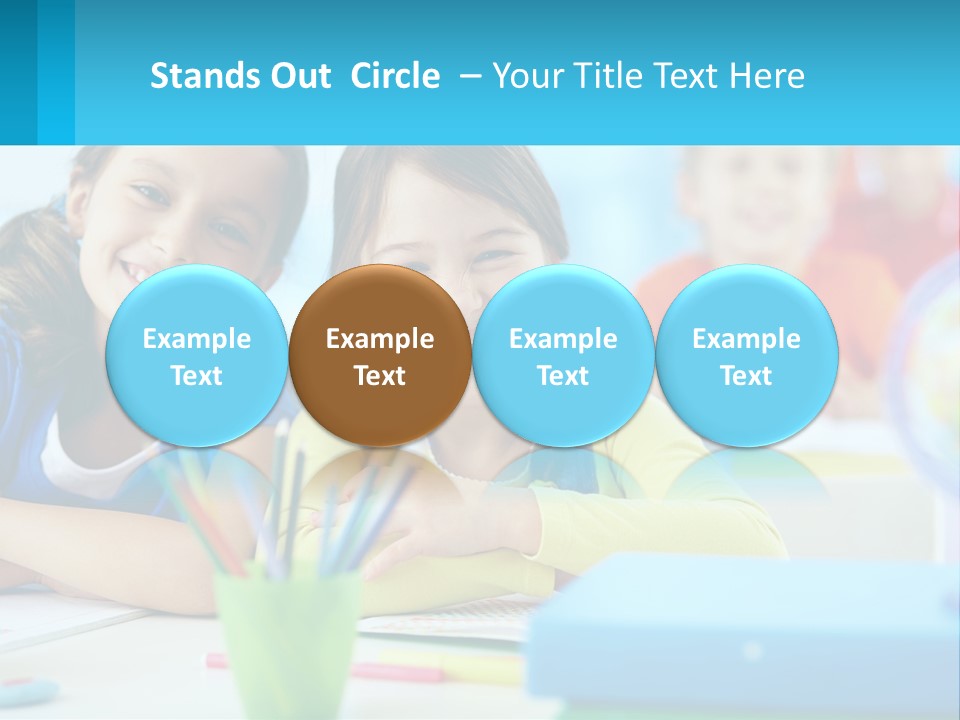 Two Young Girls Are Sitting At A Desk With Pencils PowerPoint Template