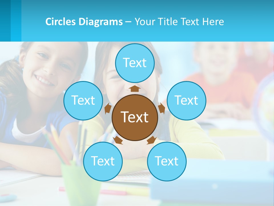 Two Young Girls Are Sitting At A Desk With Pencils PowerPoint Template