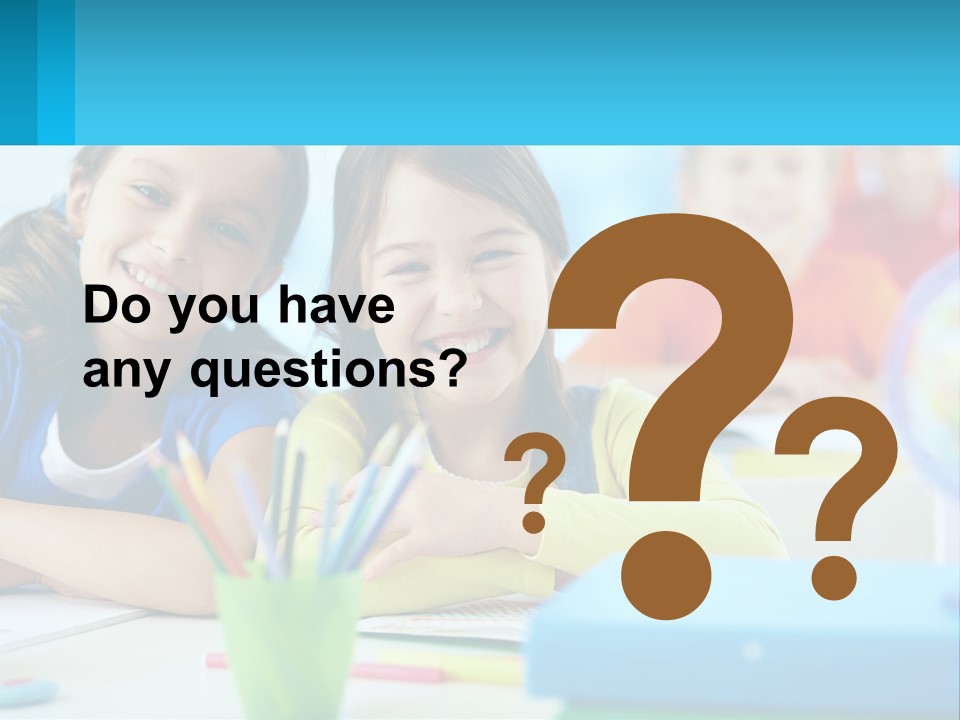 Two Young Girls Are Sitting At A Desk With Pencils PowerPoint Template