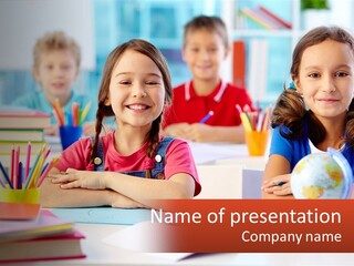 A Group Of Children Sitting At A Table PowerPoint Template