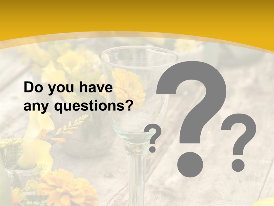 A Wooden Table Topped With Yellow Flowers And Wine Glasses PowerPoint Template