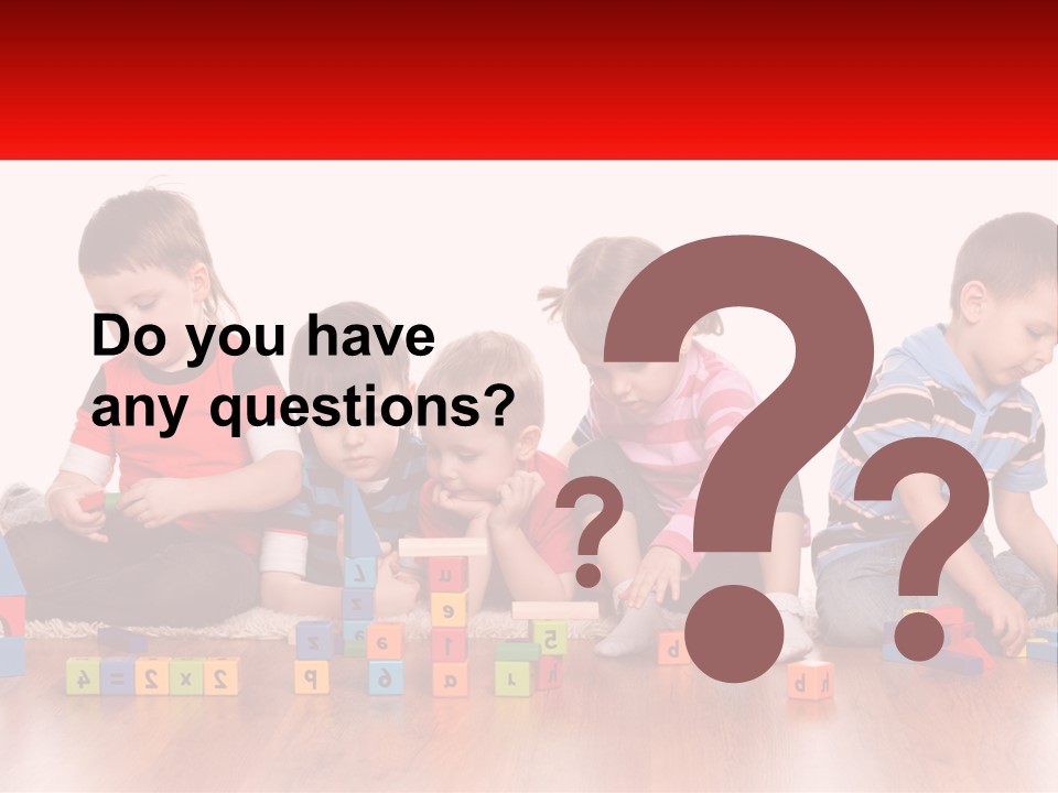 A Group Of Children Playing With Blocks On The Floor PowerPoint Template