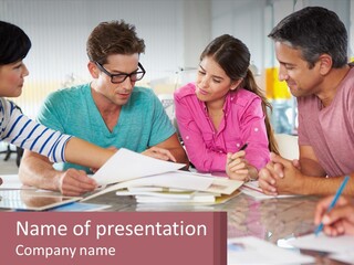 A Group Of People Sitting Around A Table Writing PowerPoint Template