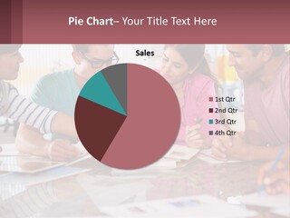A Group Of People Sitting Around A Table Writing PowerPoint Template