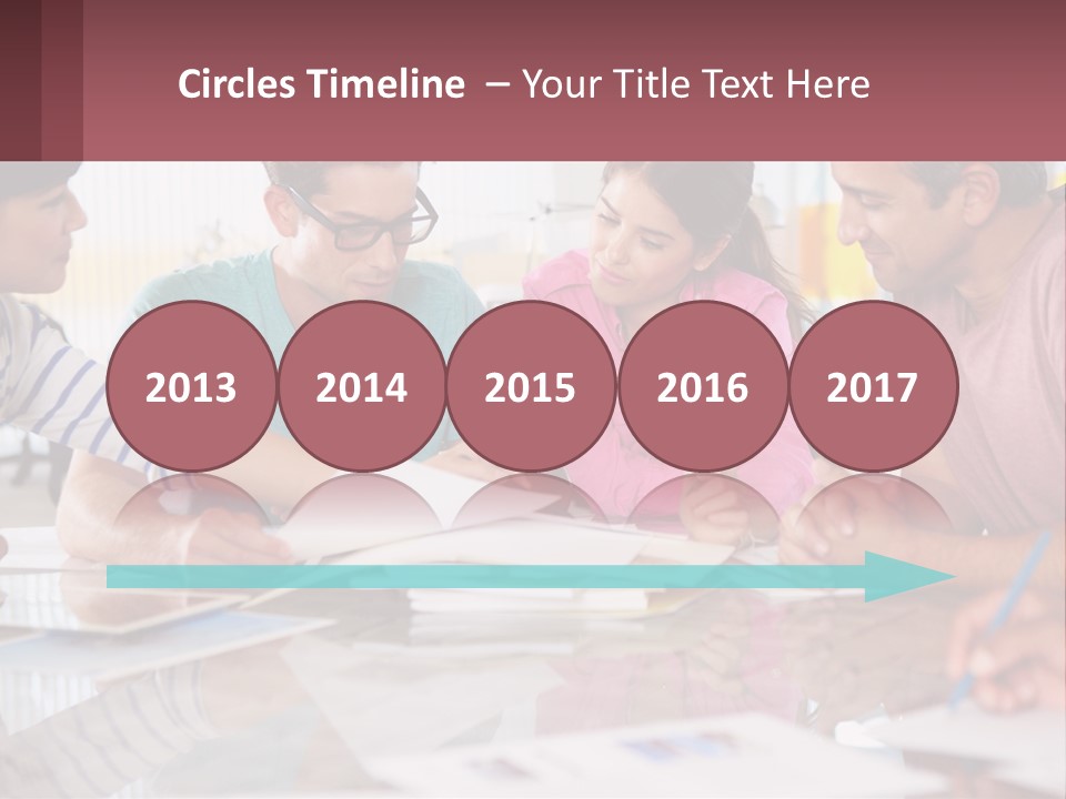 A Group Of People Sitting Around A Table Writing PowerPoint Template