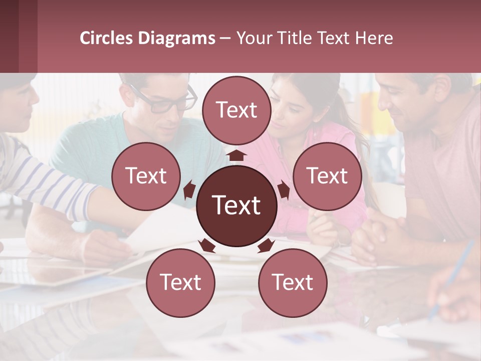 A Group Of People Sitting Around A Table Writing PowerPoint Template