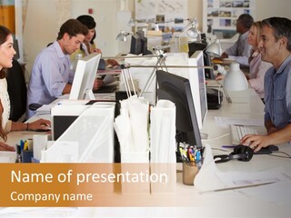 A Group Of People Working On Computers In An Office PowerPoint Template
