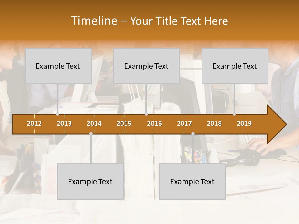 A Group Of People Working On Computers In An Office PowerPoint Template
