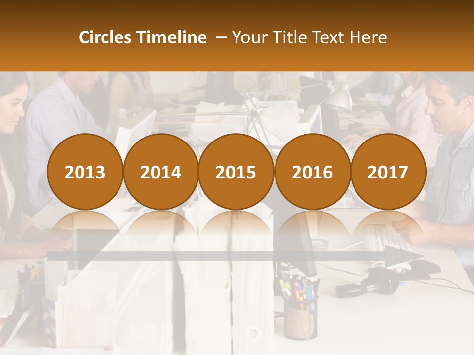 A Group Of People Working On Computers In An Office PowerPoint Template