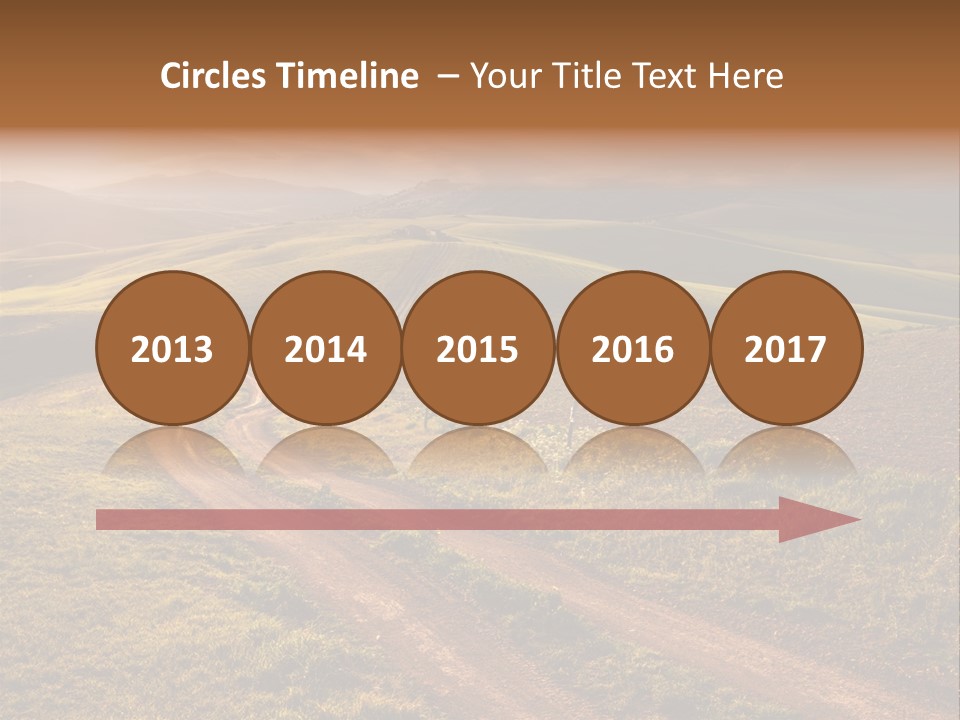 A Dirt Road In The Middle Of A Green Field PowerPoint Template
