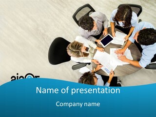 A Group Of People Sitting Around A Table With Papers PowerPoint Template
