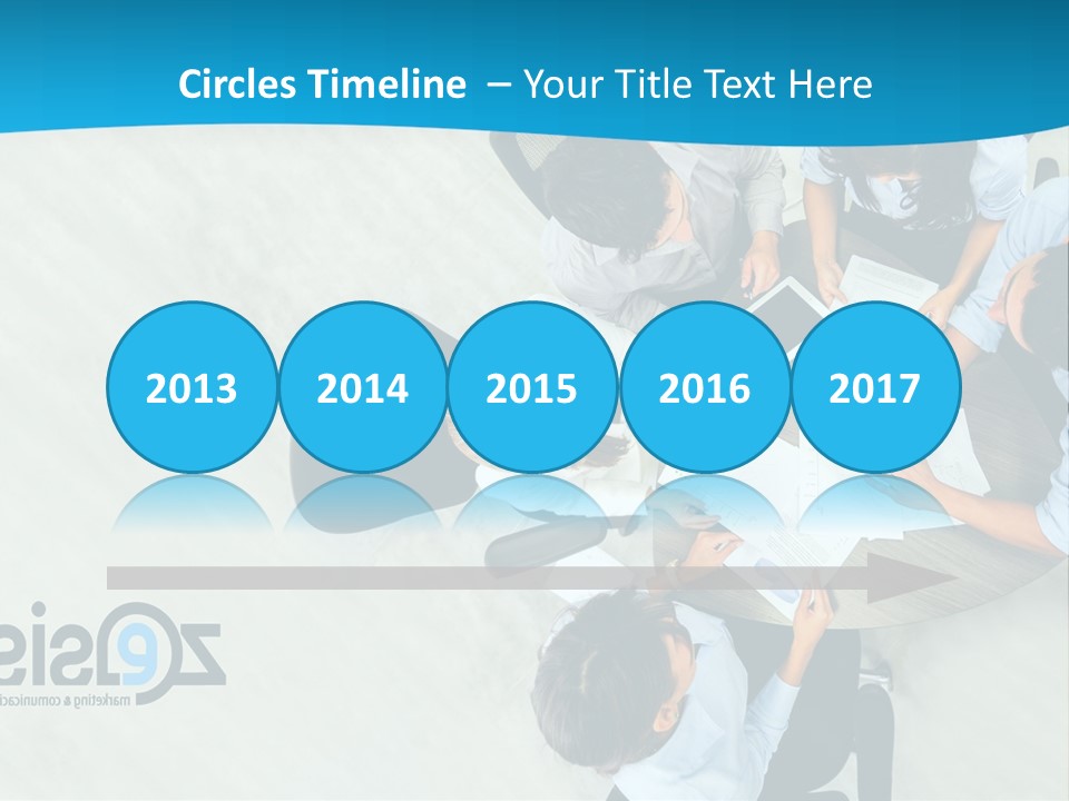 A Group Of People Sitting Around A Table With Papers PowerPoint Template
