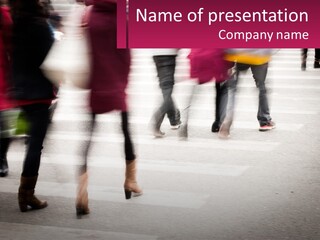 A Group Of People Walking Across A Street PowerPoint Template