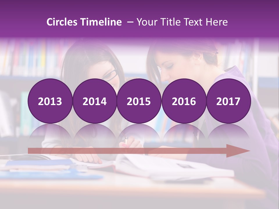Two Girls Are Writing In A Book In A Library PowerPoint Template