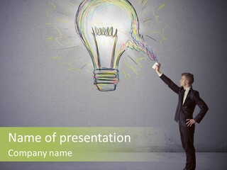 A Man Drawing A Light Bulb On A Wall PowerPoint Template