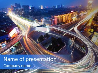 An Aerial View Of A Busy City At Night PowerPoint Template