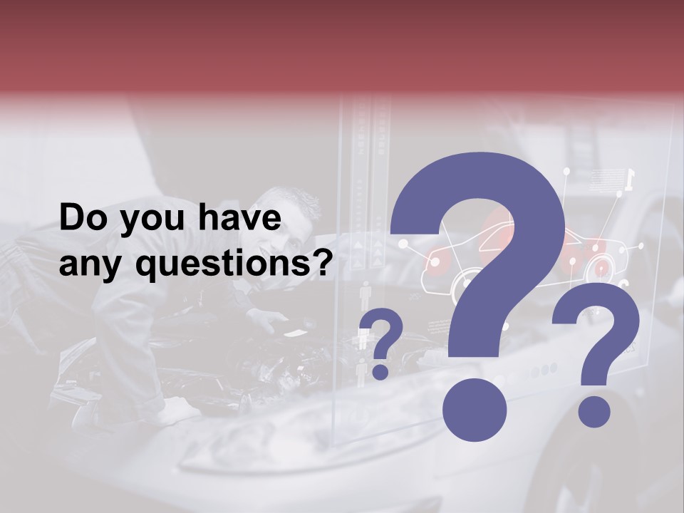 A Man Working On A Car In A Garage PowerPoint Template