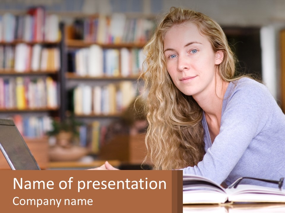 A Woman Sitting At A Table With A Book In Front Of Her PowerPoint Template