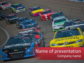 A Group Of Cars Driving Down A Race Track PowerPoint Template