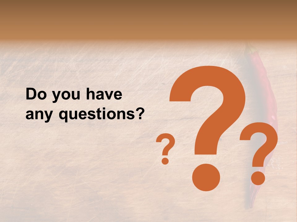 A Red Chili Pepper Sitting On Top Of A Wooden Table PowerPoint Template