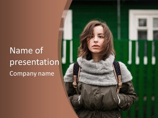 A Woman Standing In Front Of A Green Building PowerPoint Template