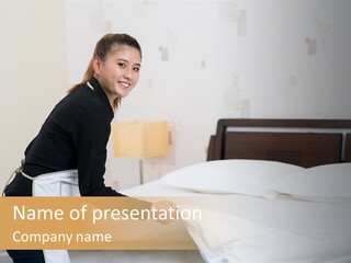 A Woman Is Sitting On A Bed And Smiling PowerPoint Template
