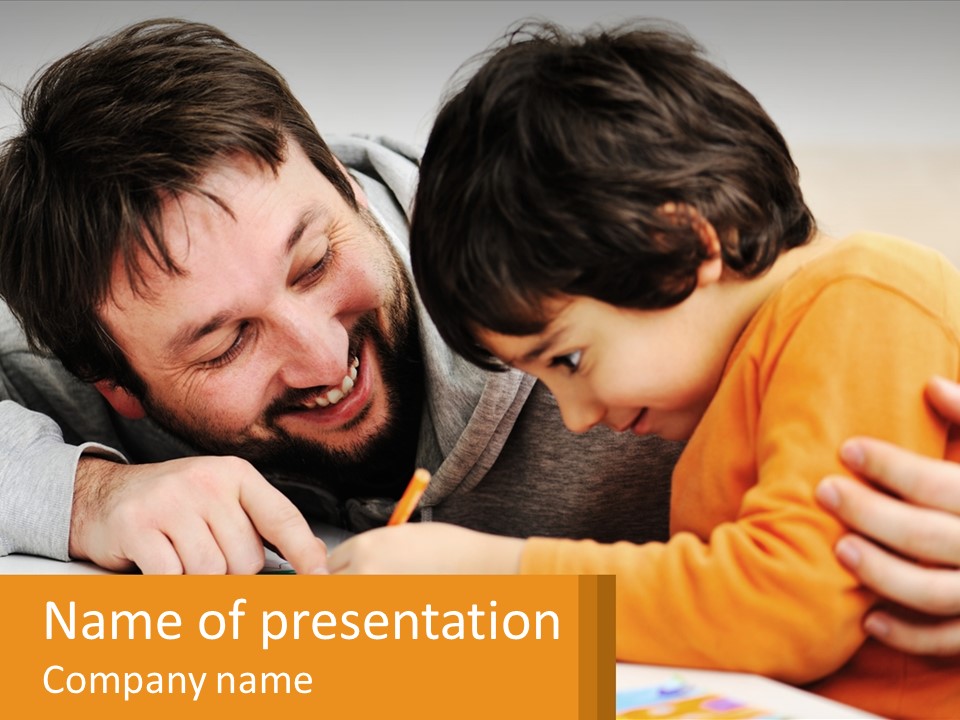 A Man And A Child Are Writing On A Piece Of Paper PowerPoint Template
