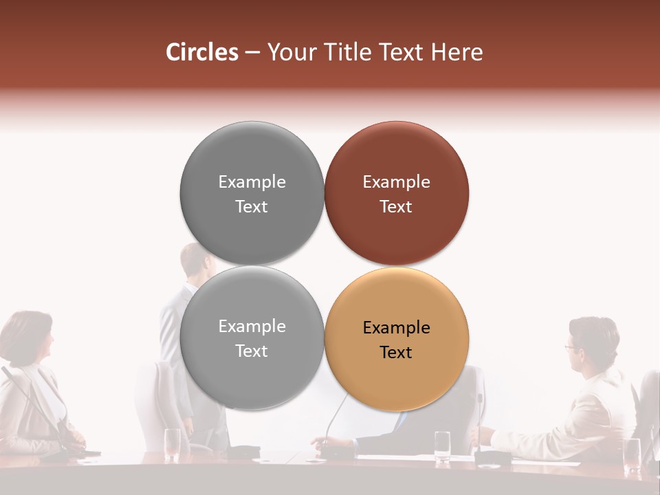 A Group Of People Sitting Around A Conference Table PowerPoint Template