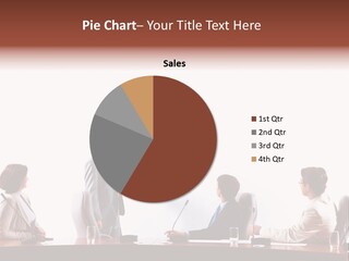 A Group Of People Sitting Around A Conference Table PowerPoint Template
