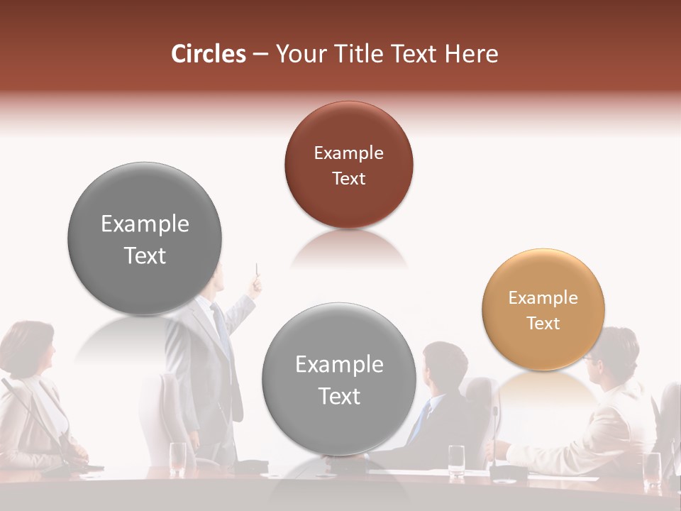 A Group Of People Sitting Around A Conference Table PowerPoint Template