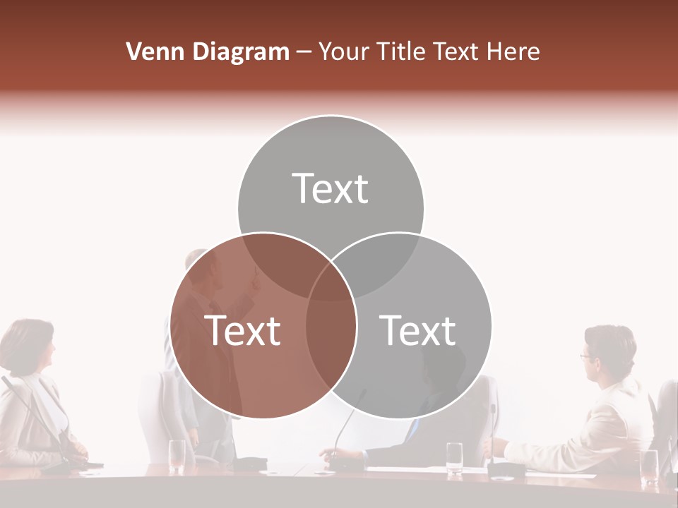 A Group Of People Sitting Around A Conference Table PowerPoint Template