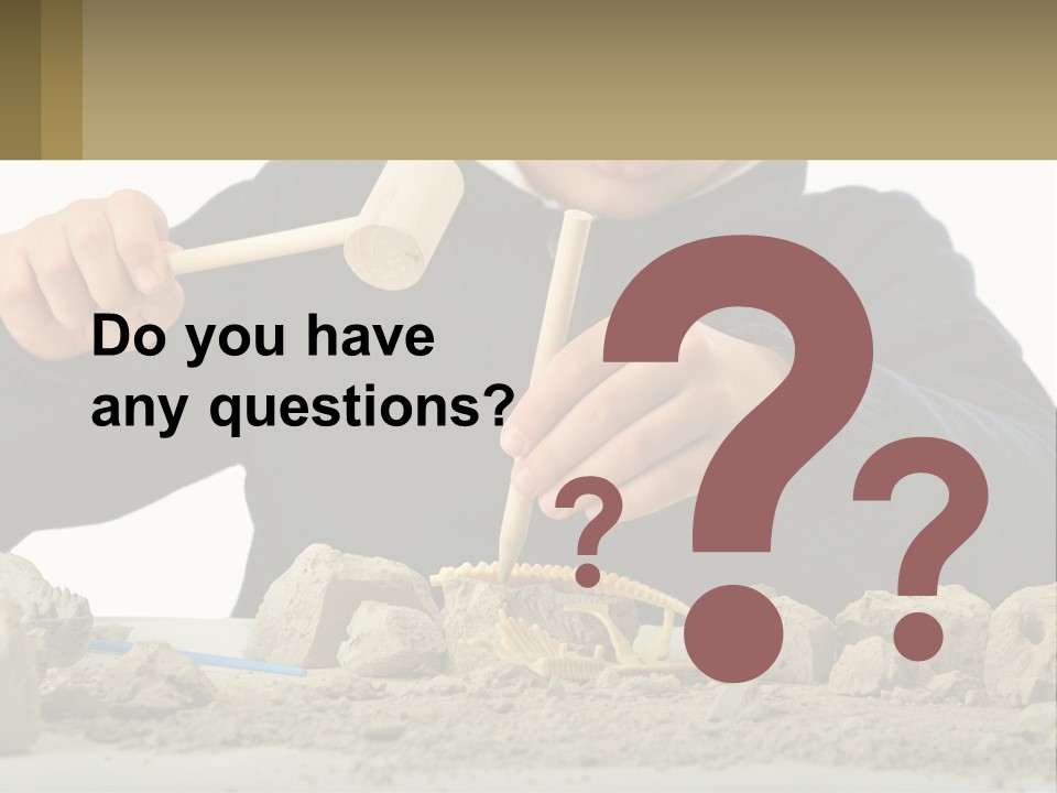A Young Boy Is Playing With A Wooden Spoon PowerPoint Template
