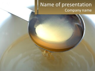 A Spoon With A Liquid Inside Of It PowerPoint Template