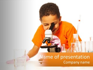 A Young Boy Is Looking Through A Microscope PowerPoint Template