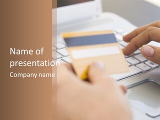 A Person Typing On A Laptop With A Credit Card PowerPoint Template