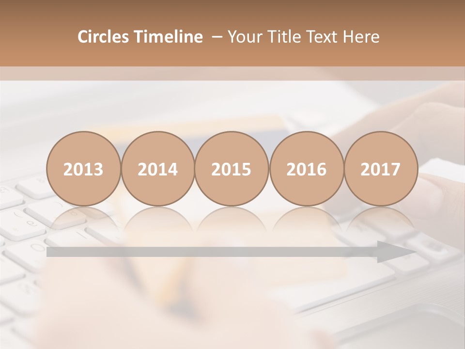 A Person Typing On A Laptop With A Credit Card PowerPoint Template