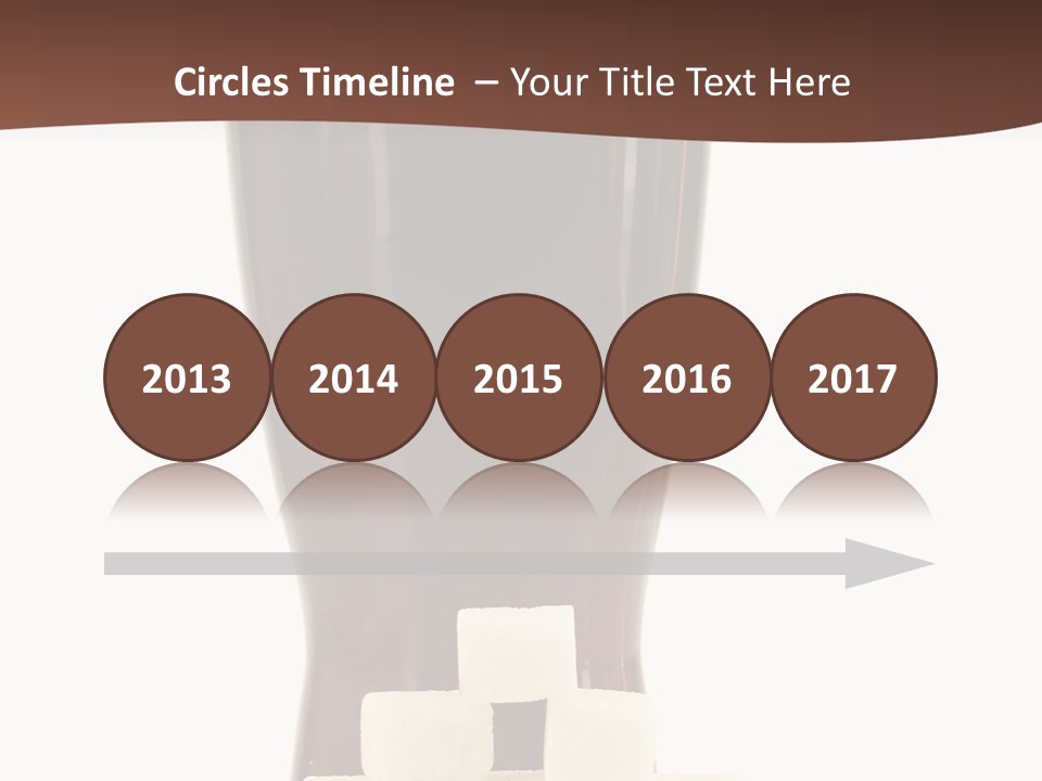 A Glass Of Beer Next To A Pile Of Ice Cubes PowerPoint Template