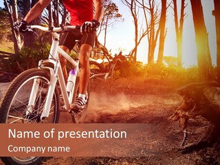 A Person Riding A Bike On A Dirt Road PowerPoint Template