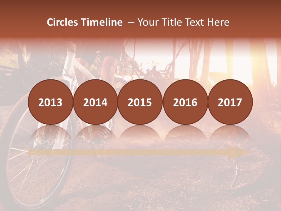 A Person Riding A Bike On A Dirt Road PowerPoint Template